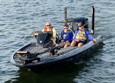 Assistant Coach Bill Smith captains the boat during competition on Lake Cumberland 