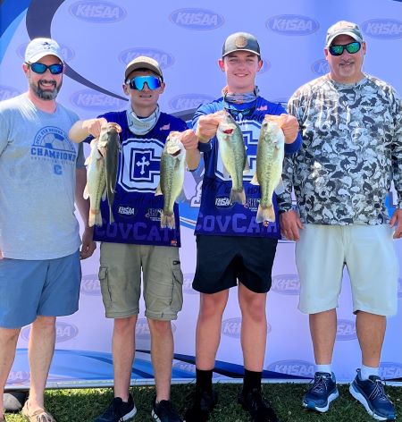 Covington Catholic Bass Fishing Coach Robb Schneeman, Assistant Coach Bill Smith with team members Sam Scroggins and Brandon at competition weigh-in.