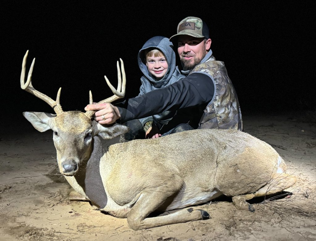 Waylon Skinner shows of his first-ever buck, that he harvested alongside his father while hunting on their family property.