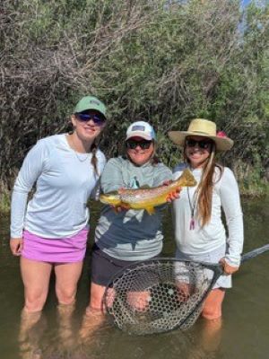 From left: Lilly, Havely and guide Kara fly fishing in Montana.